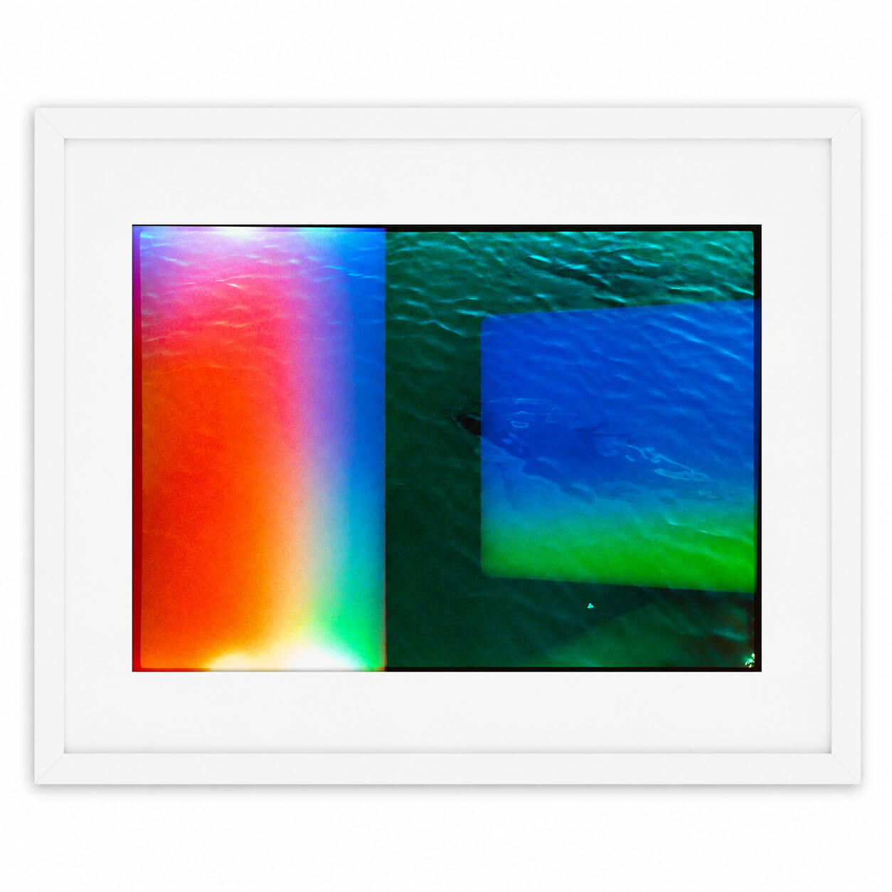 A framed abstract art print featuring a split design: a vertical gradient of red, orange, yellow, green, and blue on the left, and a textured green and blue abstract square on the right, enclosed in a white frame.